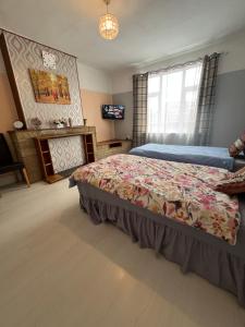 a bedroom with a bed and a television in it at Private Room 2 Near Southmead Hospital in Bristol