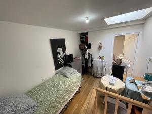 a living room with a couch and a table at Room in city Nice in Nice