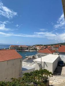 a view of the ocean from the roof of a building at Apartments San Giorgio in Sućuraj