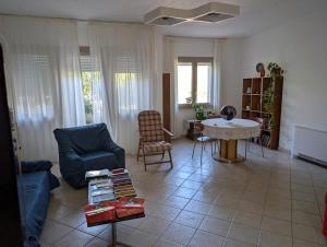 a living room with a couch and a table at Casa MAM in Albagiara