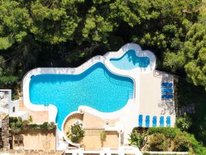 an aerial view of a swimming pool at a resort at Beautiful Golfside Hideaway in Benahavís