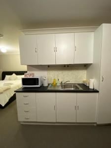 Kuchyň nebo kuchyňský kout v ubytování Cosy Studio