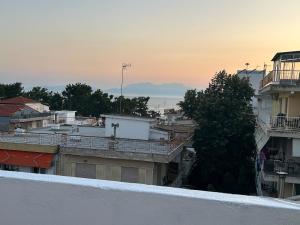 a view of a city from the roof of a building at Relax INN Sea and Olympus View in Nea Kallikrateia