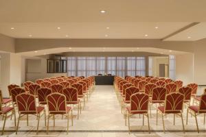 a room with rows of chairs in a building at NH Santiago del Estero in Santiago del Estero