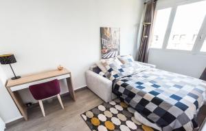 Ένα ή περισσότερα κρεβάτια σε δωμάτιο στο Cosy apartment - Montrouge