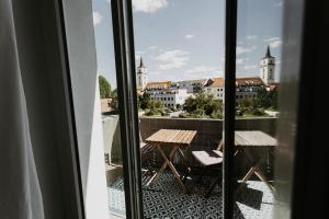 a view of a balcony with a table and chairs at Bauhaus Museum Apartment in Dessau