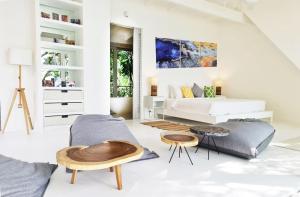 a living room with a bed and a couch at The Headland Villa 2, Samui in Koh Samui