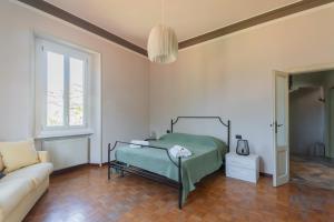 Ένα ή περισσότερα κρεβάτια σε δωμάτιο στο Villa Giovannina