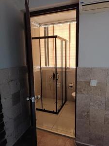 a bathroom with a shower with a glass door at Noo 15 in Side