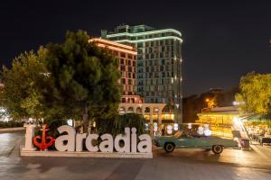 a car is parked in front of a building at Archotel Avenue in Odesa