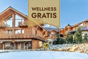 a mountain home with the words wellness crafts at Chalets CEDER 1 in Tatranská Lomnica