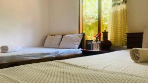 Postel nebo postele na pokoji v ubytování Ramboda Jungle Resort + 5 fotografií