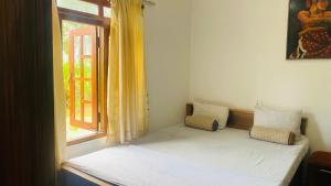 Postel nebo postele na pokoji v ubytování Ramboda Jungle Resort + 4 fotografie