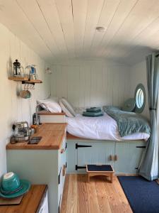 a bedroom with a bed in a small room at Sea Spray in St Austell