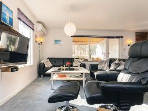 a living room with a couch and a table at 7 person holiday home in Spøttrup in Spottrup