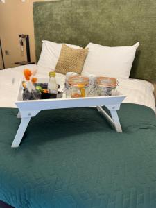 a tray of food sitting on a bed at The Falcon Inn in Long Whatton