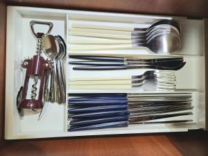 a drawer filled with dishes and utensils at on stay EMart the air conditioner in each room Free parking Gyodong Jjamppong Vegan Bakery Bus Terminal Civic Culture Center Peace Square Gotbawi Gong in Mokpo +12 photos
