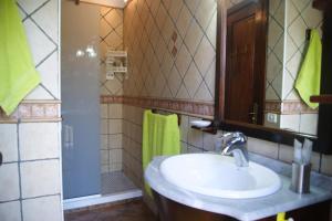 a bathroom with a sink and a shower at Casas del Monte in Valverde +18 photos