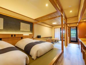 Postel nebo postele na pokoji v ubytování Mizunoto Reopening on April 1, 2025
