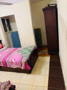 a bedroom with a bed and a dresser in a room at اهلا وسهلا في الاردن in Petra +1 photo