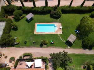 an overhead view of a garden with a swimming pool at "IL CASALE DEI GIRASOLI" Country House in Capalbio in Capalbio