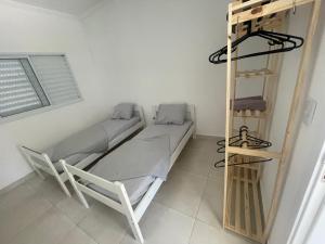 Postel nebo postele na pokoji v ubytování Sobrado invertido 2 Quartos