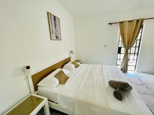 Ένα ή περισσότερα κρεβάτια σε δωμάτιο στο Mont Choisy Lodge - Cactus Apartment