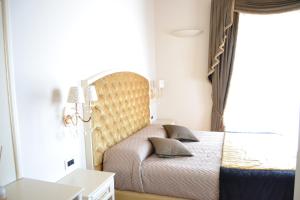 Postel nebo postele na pokoji v ubytování Agriturismo De Luca