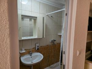 a bathroom with a sink and a mirror at Apartmani Jelena in Neum +81 photos