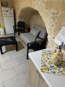 a living room with a couch and a table at futura home centro storico 5 minuti da Bari in Modugno
