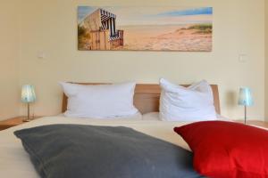 Postel nebo postele na pokoji v ubytování Ferienhaus Boddenzauber