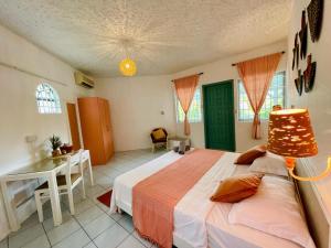 Ένα ή περισσότερα κρεβάτια σε δωμάτιο στο Mont Choisy Lodge - Coral Apartment