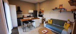 a living room with a couch and a table at Nou Dor Ter La in Entre-Deux