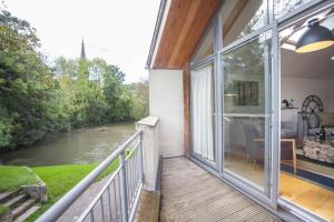 a balcony with a view of a river at 2 Bed in Bath oc-bhr9 in Bath