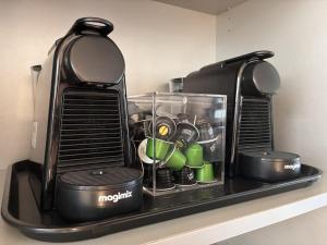 a coffee maker sitting on a shelf next to a coffee maker at LOFT maison 5ch 5sdb 5wc Lille 200m2 avec extérieur in Lambersart