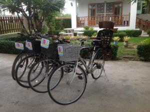 two bikes are parked next to each other at 2N Guesthouse in Phetchaburi