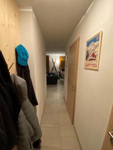 a hallway with a person standing in a room at C03 lajoue in Le Dévoluy +40 photos