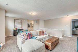 a living room with a couch and a coffee table at Lavish HUGE Noblesville and Carmel adjacent family home in Noblesville