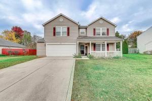 a large house with a driveway in front of it at Lavish HUGE Noblesville and Carmel adjacent family home in Noblesville