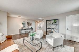 a living room with two chairs and a table at Lavish HUGE Noblesville and Carmel adjacent family home in Noblesville +25 photos