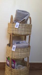 a stack of wicker baskets with towels on them at Casa Tranquila Airpot Transit Stay in Dar es Salaam