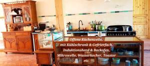 a kitchen with a counter with a sign on it at Scheunenloft Usedom -3- Familienoase bis 6 Pax spacious big garden dog-friendly - SiLyVi homes in Mellenthin