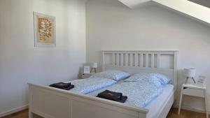 Katil atau katil-katil dalam bilik di Apartment Lu16 Four Bamberg - modern in zentral Lage