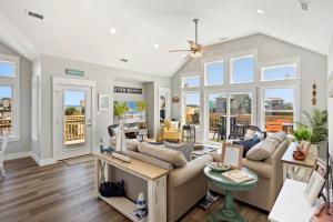 a living room with a couch and a table at 8305 - The Sound of Sunshine in Avon +56 photos