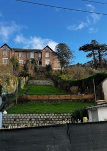 a house with a garden in front of it at Fécamp Beachfront House in Fécamp