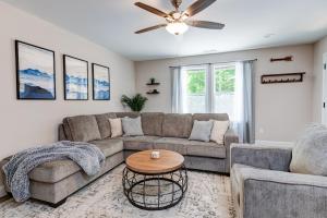 a living room with a couch and a table at Rustic Chic Mountain Home 15 min from DT Asheville in Fletcher