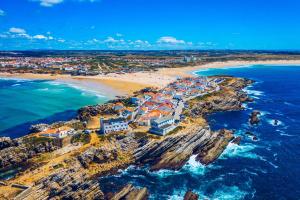 an aerial view of a beach and the ocean at Baleal Classic Waves Guest House in Baleal