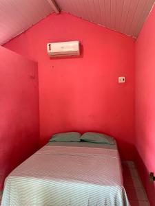 Postel nebo postele na pokoji v ubytování Chalé do Pedro + 8 fotografií