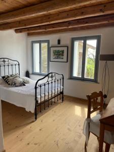Postel nebo postele na pokoji v ubytování Casale nel mezzo dei vigneti