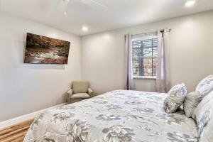 a bedroom with a bed and a window at Cozy Retreat Near Downtown with Hot Tub in Sevierville +47 photos